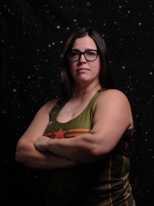 Salty is glaring at the screen with her arms crossed