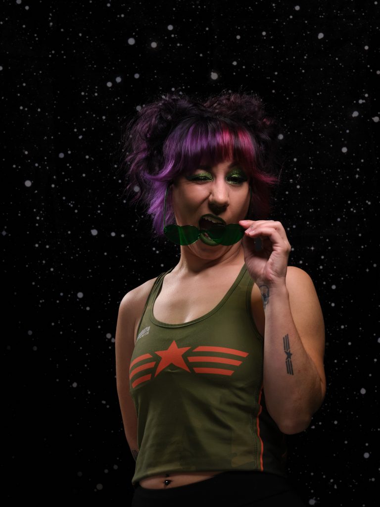 Sassberry is winking behind a pair of sunglasses