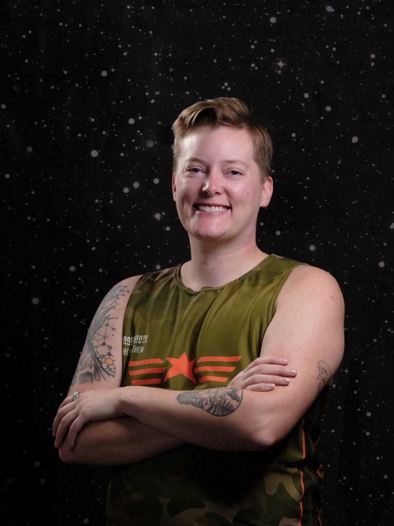 Raffi is smiling at the camera